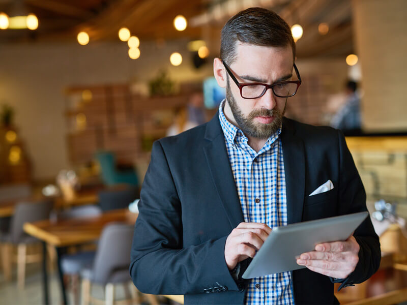 restaurant manager using apple ipad tablet